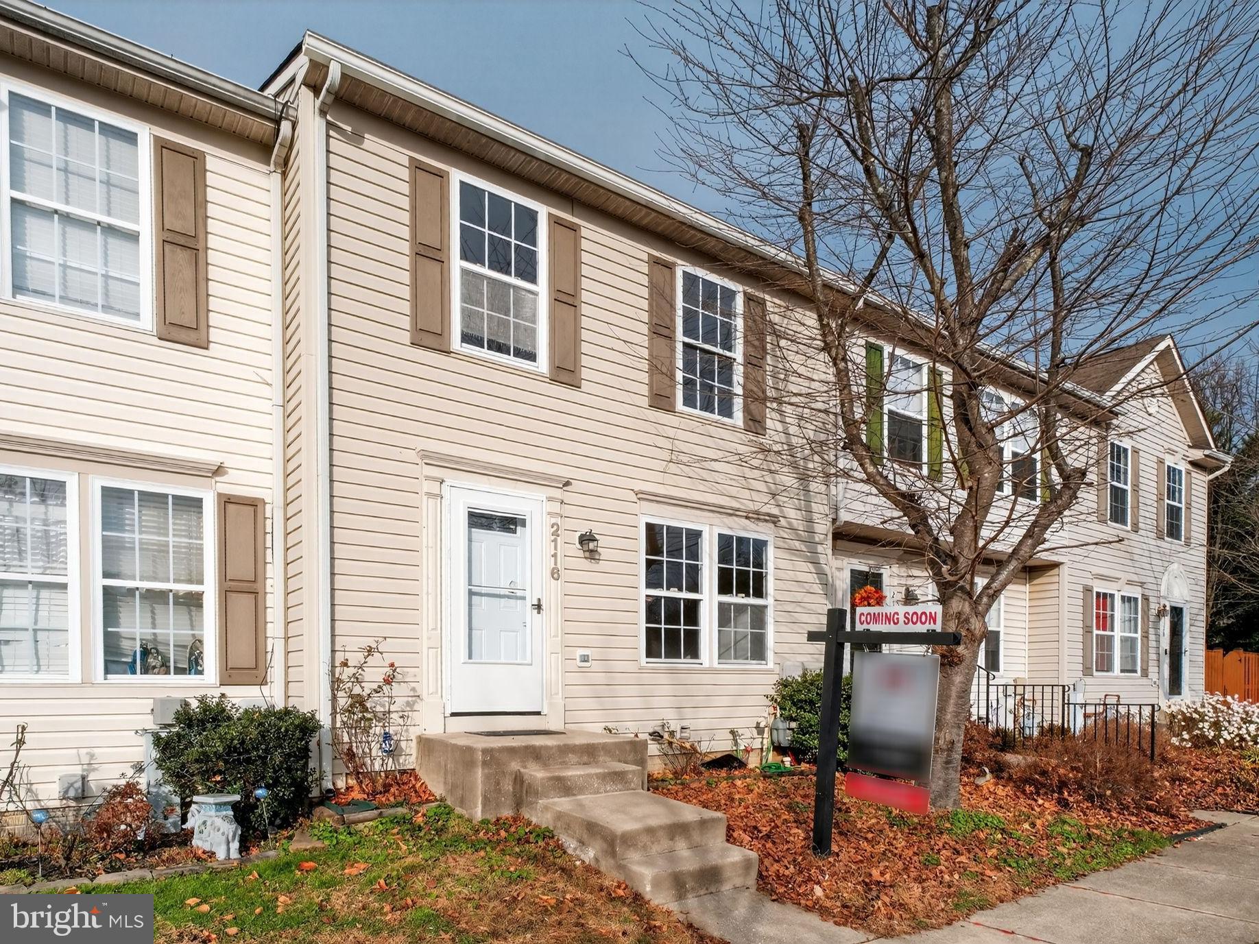 a front view of a house with outdoor seating