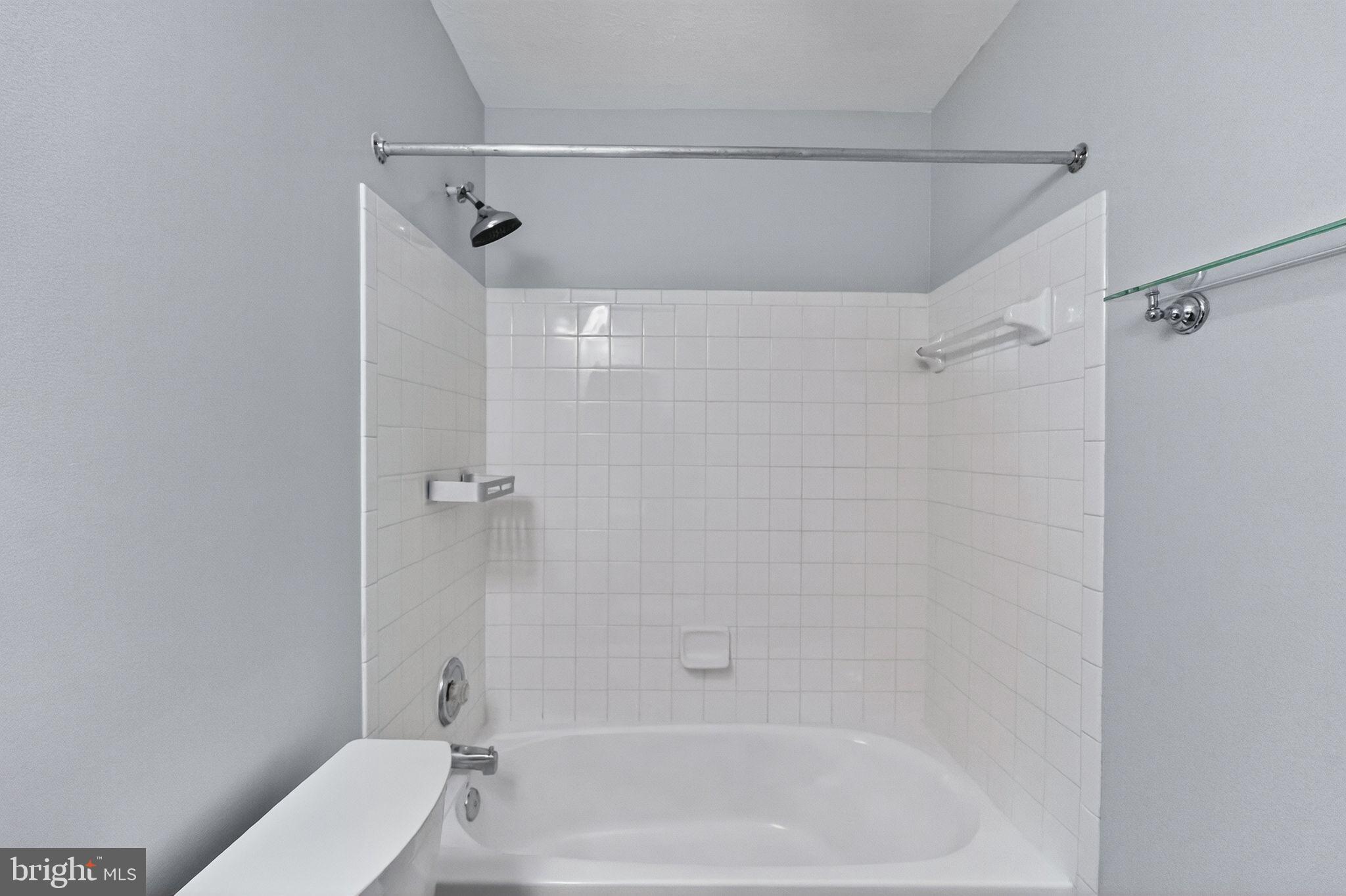 2116 Amber Way Baltimore, MD 21244 - Photo 13 of 22 a bathroom with a shower and a toilet