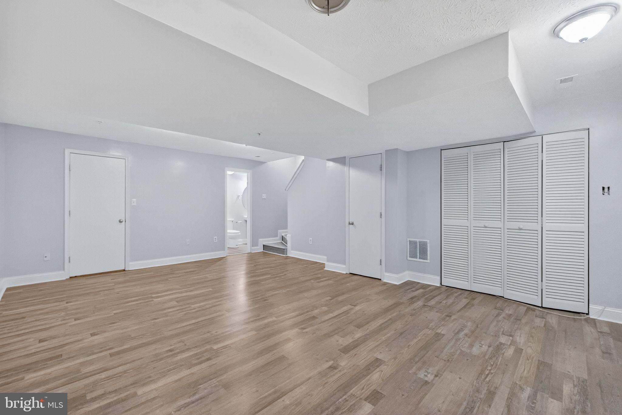 2116 Amber Way Baltimore, MD 21244 - Photo 14 of 22 a view of an empty room with wooden floor