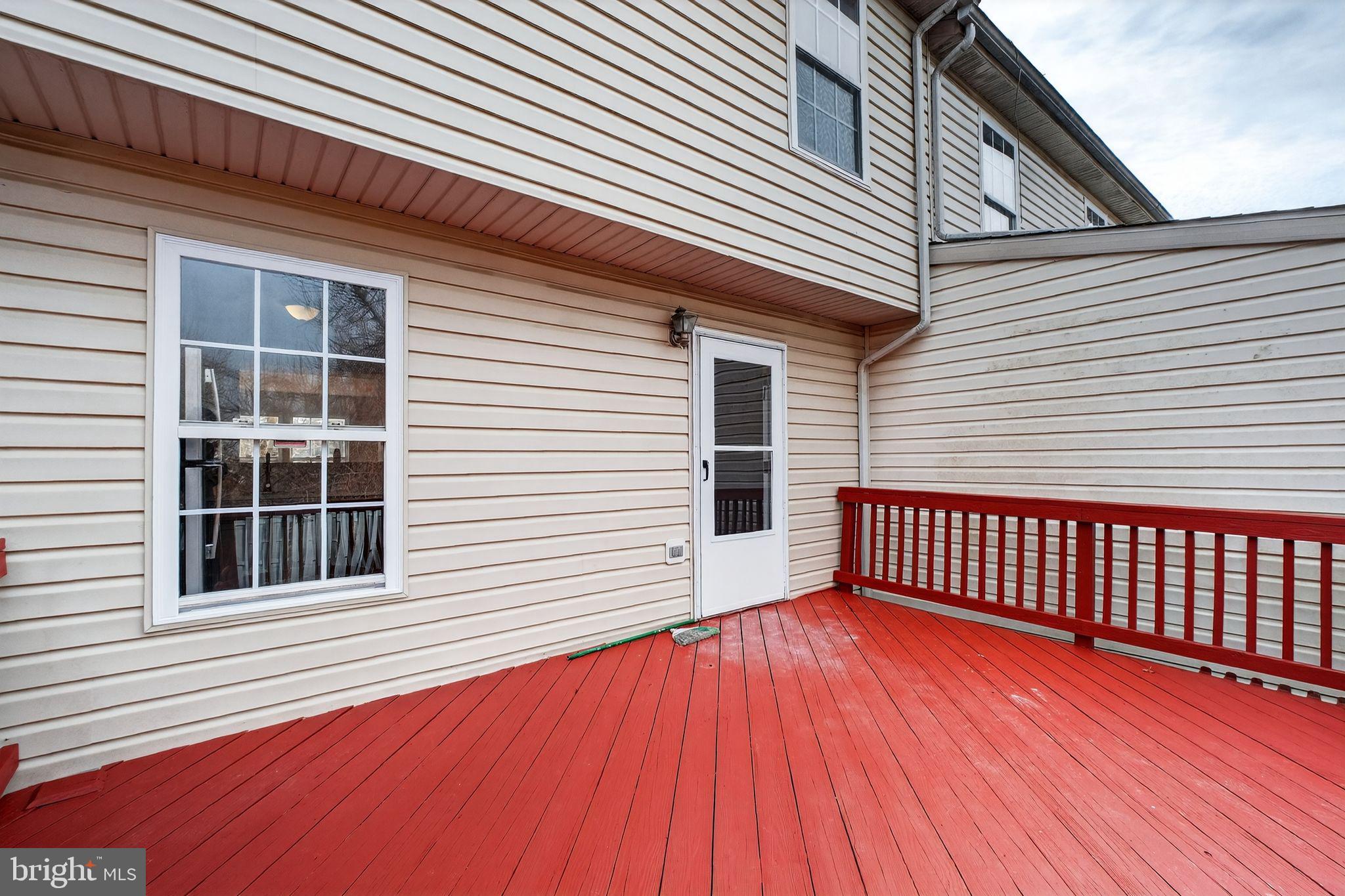 2116 Amber Way Baltimore, MD 21244 - Photo 19 of 22 a view of a house with wooden deck