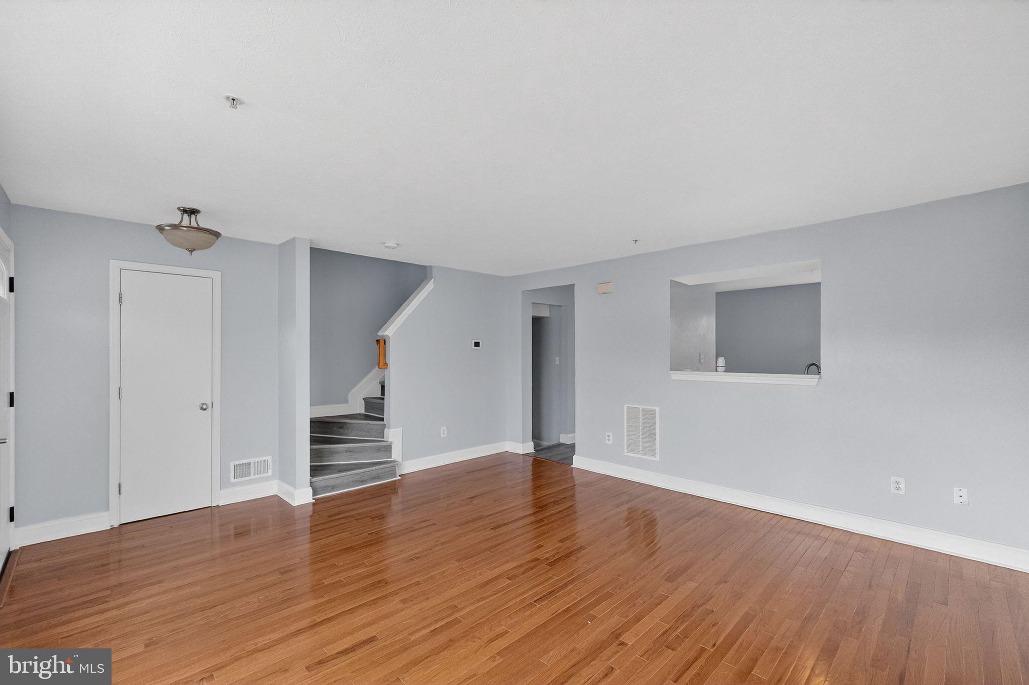 2116 Amber Way Baltimore, MD 21244 - Photo 5 of 22 a view of empty room with wooden floor
