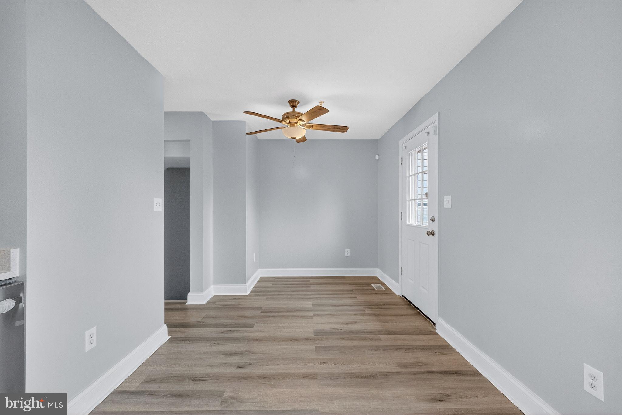 2116 Amber Way Baltimore, MD 21244 - Photo 6 of 22 a view of an empty room with wooden floor