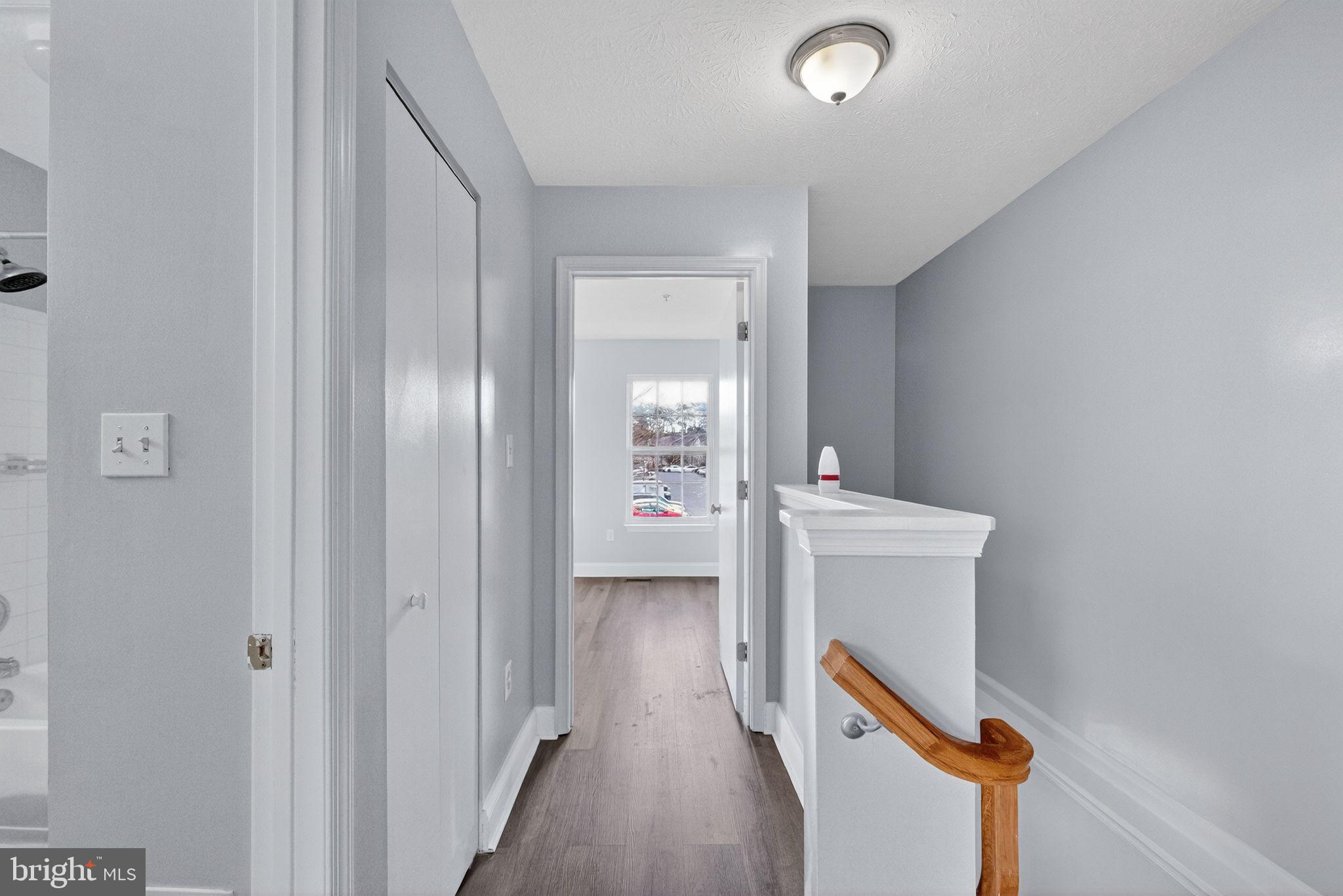 2116 Amber Way Baltimore, MD 21244 - Photo 10 of 22 a bathroom with a toilet sink and mirror