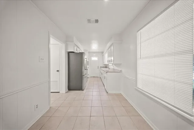 a view of a storage & utility room with a sink