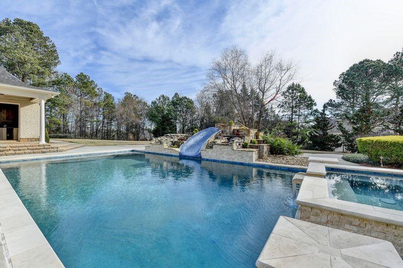 4045 Ridge Road Buford, GA 30519 - Photo 80 of 97 a view of swimming pool with outdoor seating and plants