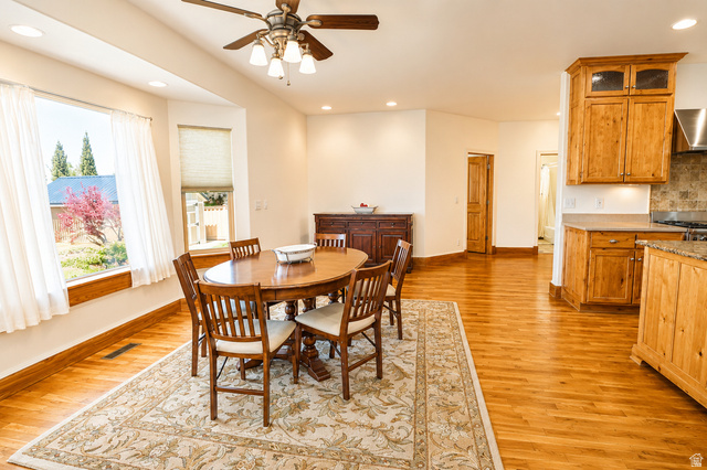 1055 North 1000 East Mapleton, UT 84664 - Photo 29 of 112 Open-concept dining area featuring wood-finish flooring, recessed lighting, and a multi-pane bay window