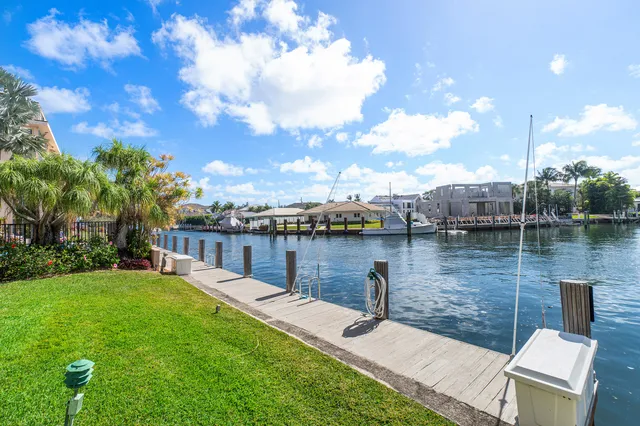 a wooden bench sitting next to a lake