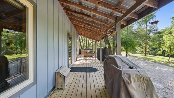 a kitchen with a sink a stove and cabinets