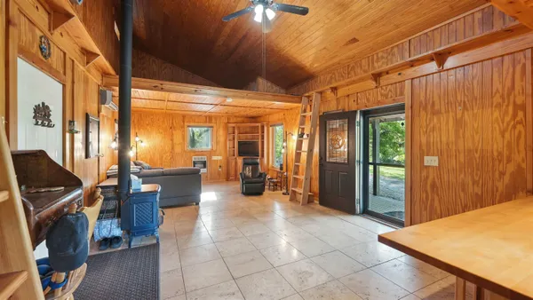 a bedroom with a bed and a table