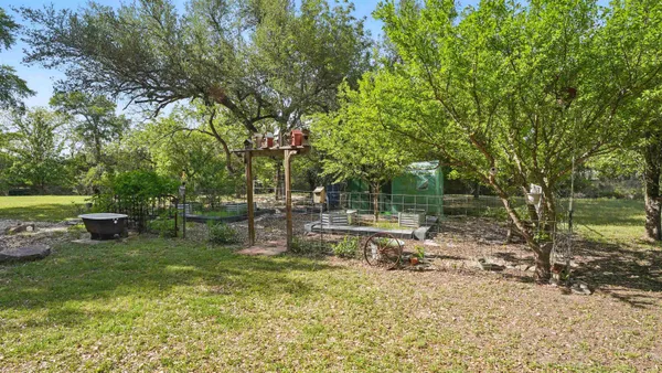 a view of a backyard with sitting area