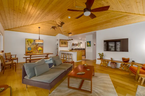 a view of a dining room with furniture and wooden floor