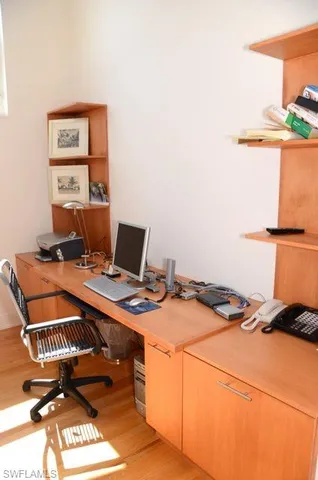 a workspace with furniture and window