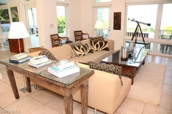 a living room with dining table and a couch