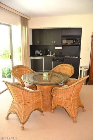 a room with two tables and chairs