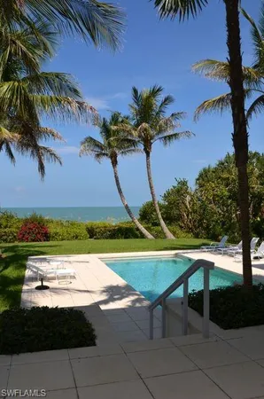 a view of a swimming pool with a yard