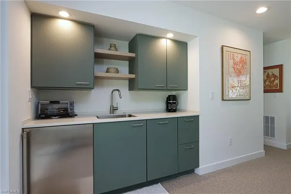 a kitchen with cabinets and a sink