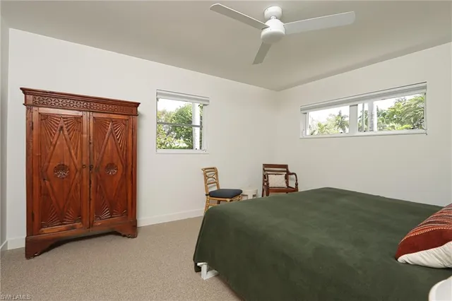 a bedroom with a bed and a cabinets