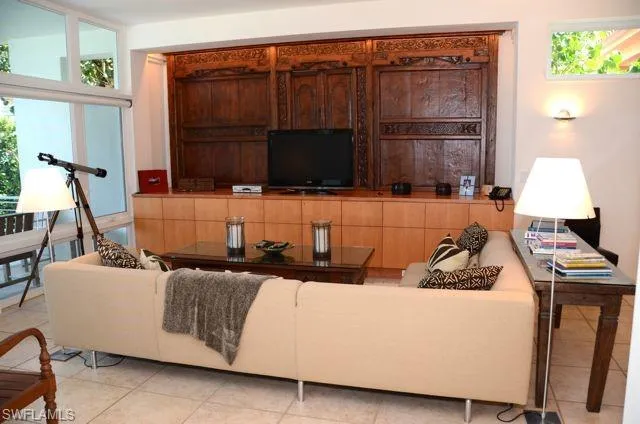 a living room with a couch and a flat screen tv