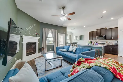 a view of a livingroom with furniture window and wooden floor