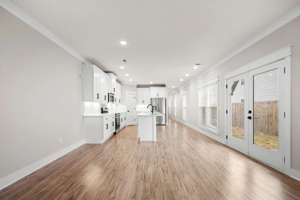 a view of a kitchen with wooden floor