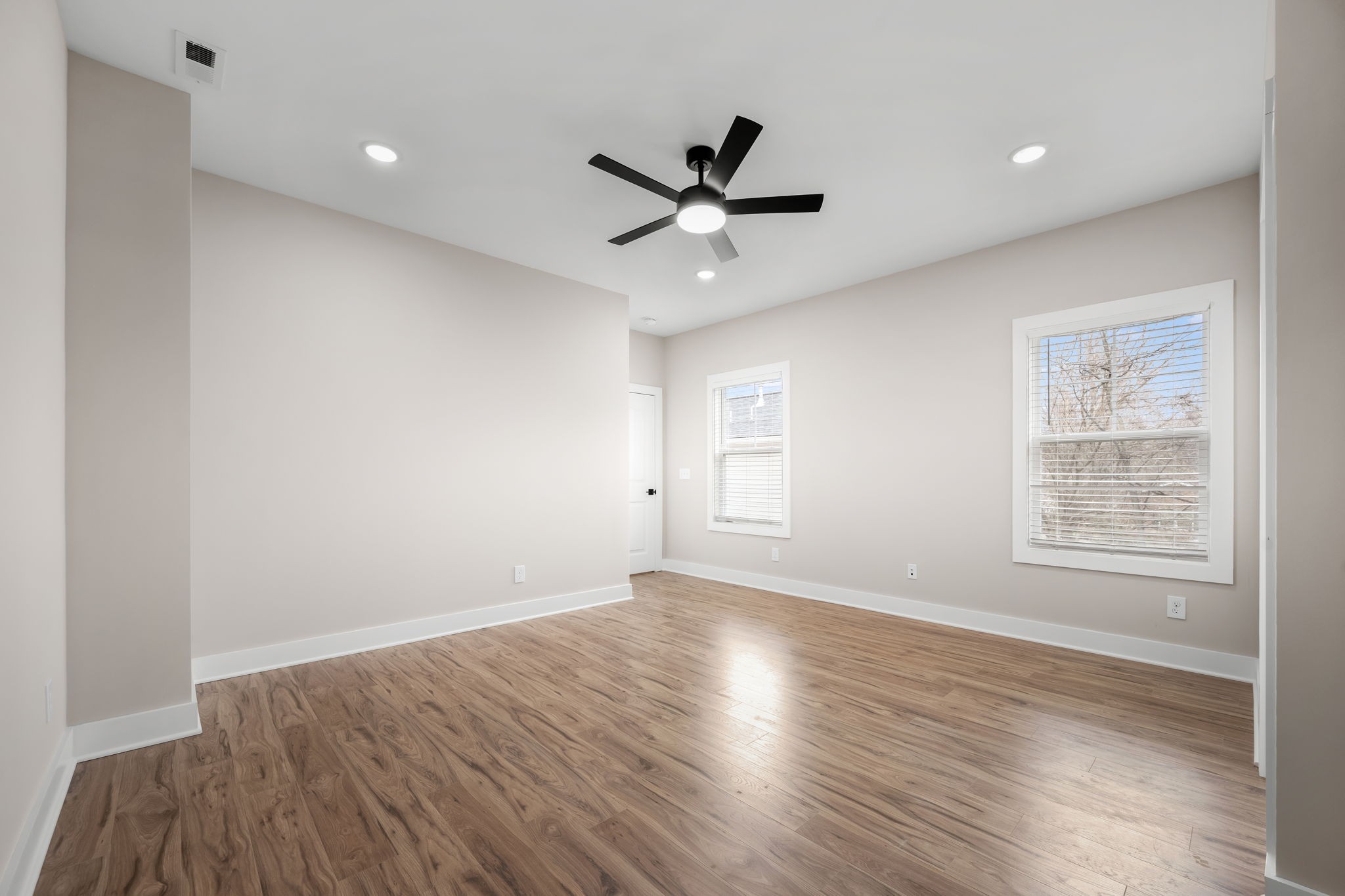454 East State Street Murfreesboro, TN 37130 - Photo 20 of 41 a view of an empty room with wooden floor and a window