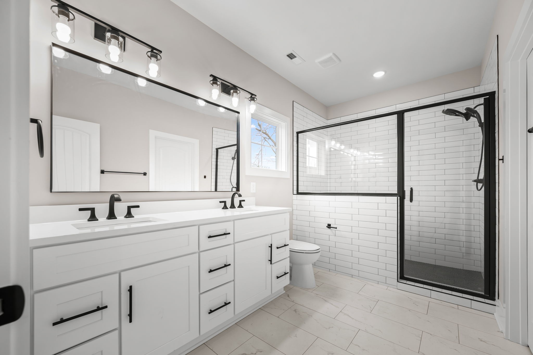 454 East State Street Murfreesboro, TN 37130 - Photo 21 of 41 a bathroom with a double vanity sink toilet mirror and shower