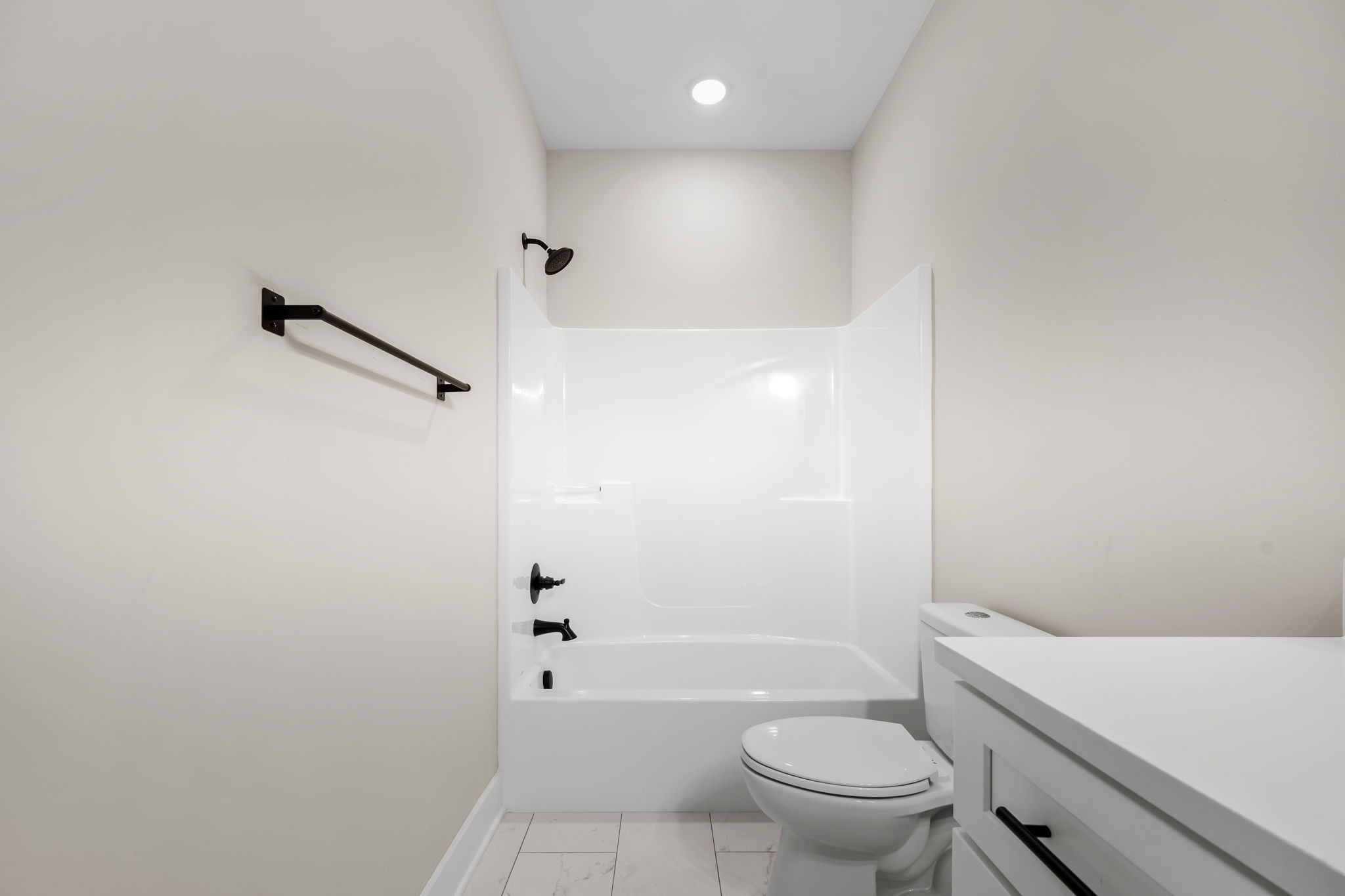 454 East State Street Murfreesboro, TN 37130 - Photo 29 of 41 a bathroom with a granite countertop sink a toilet and shower