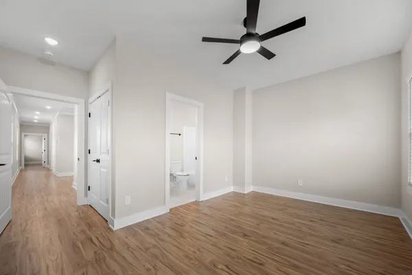 a view of a room with wooden floor