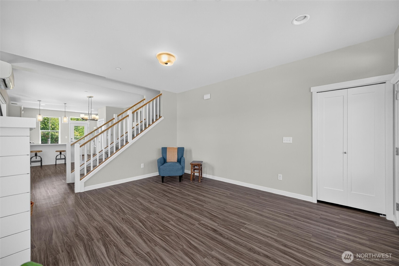 4780 Spring Brook Street Bellingham, WA 98226 - Photo 8 of 40 a view of staircase with white walls and wooden floor