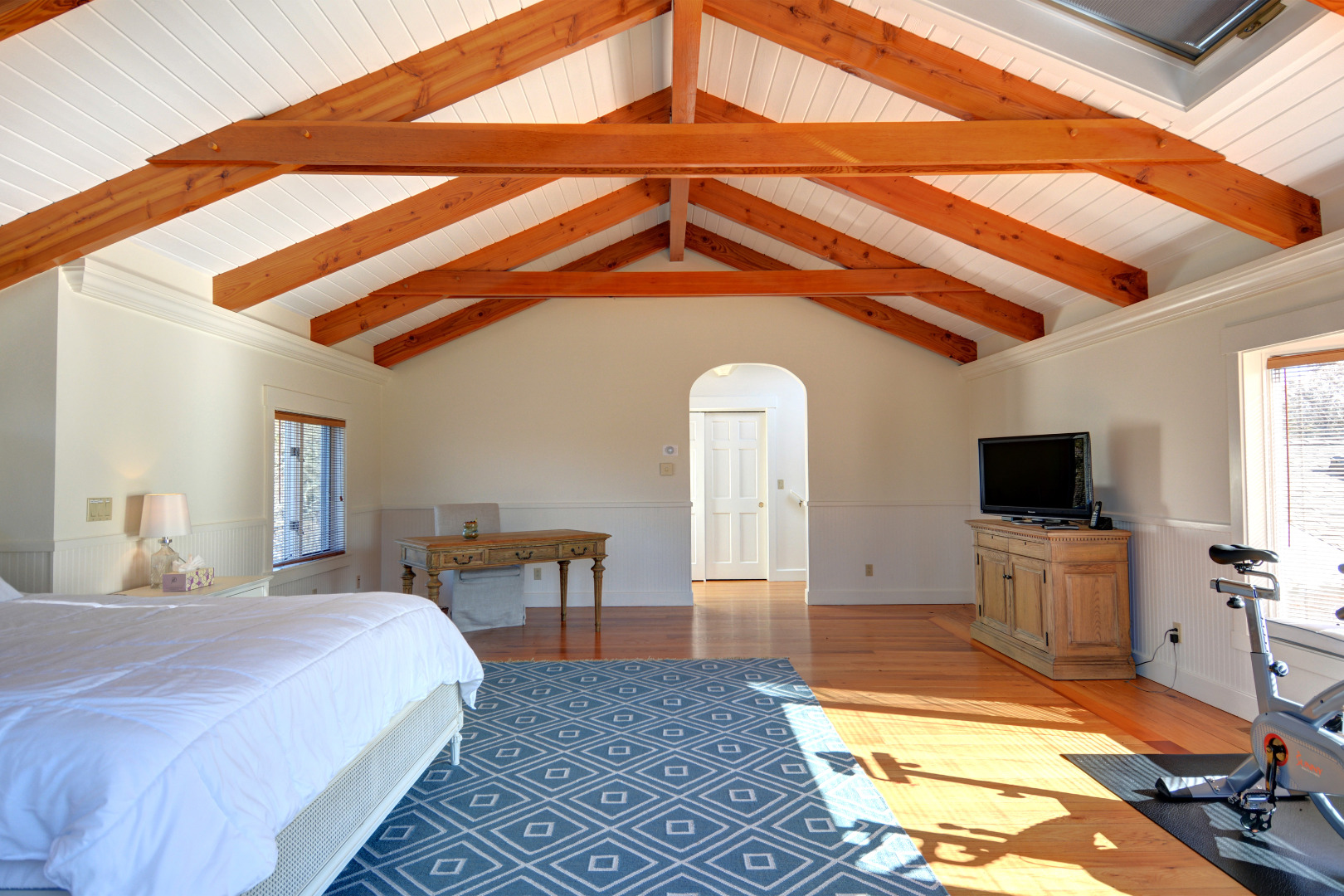 1 Smith Lane Chilmark, MA 02535 - Photo 23 of 27 a spacious bedroom with a bed a table and chair