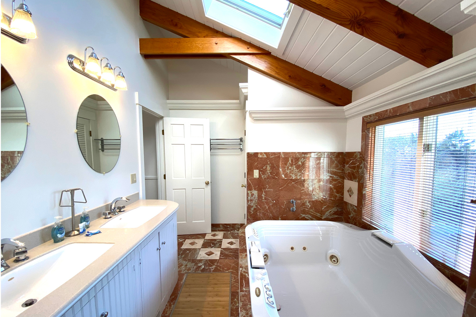 1 Smith Lane Chilmark, MA 02535 - Photo 24 of 27 a bathroom with a bathtub a sink and a large mirror