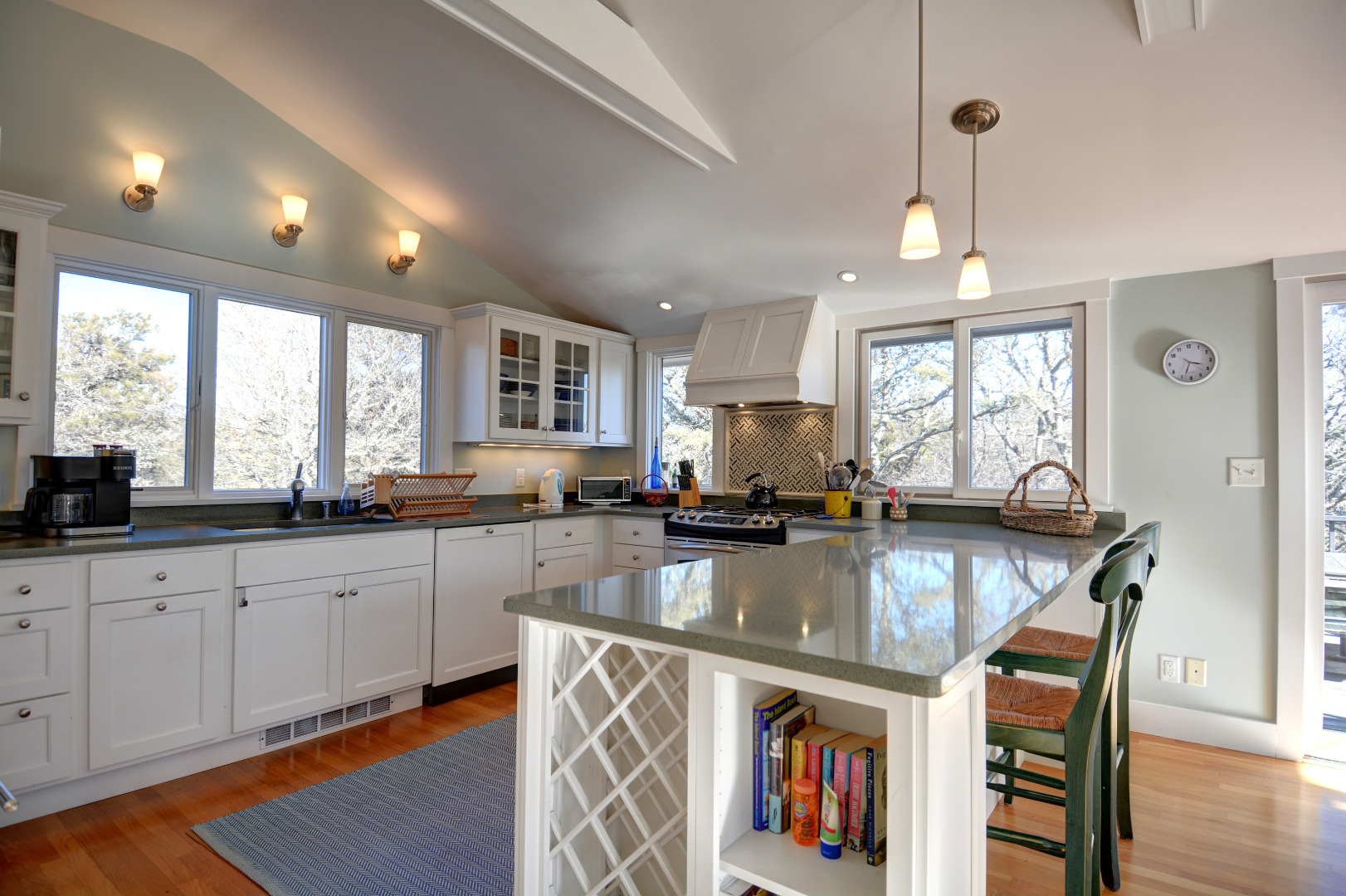 1 Smith Lane Chilmark, MA 02535 - Photo 8 of 27 a kitchen with stainless steel appliances granite countertop a stove top oven a sink a dining table and chairs with wooden floor
