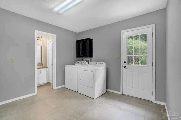 a view of a livingroom with furniture ceiling fan and window