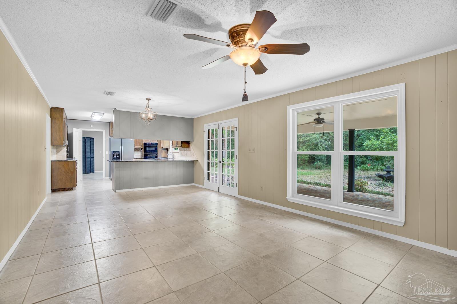 5036 Hamilton Lane Pace, FL 32571 - Photo 15 of 37 a view of a livingroom with furniture ceiling fan and window