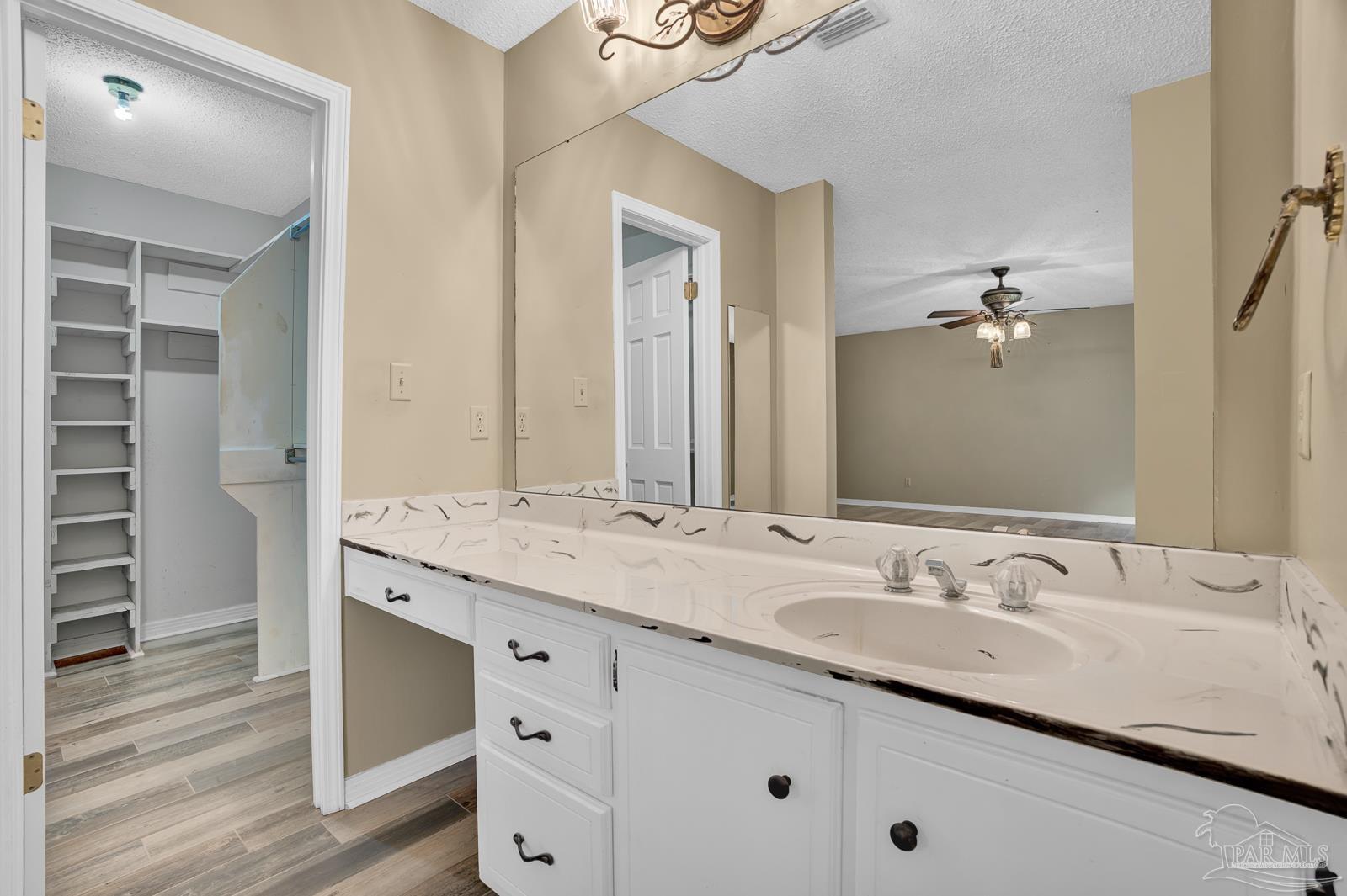 5036 Hamilton Lane Pace, FL 32571 - Photo 20 of 37 a bathroom with a sink double vanity and a mirror
