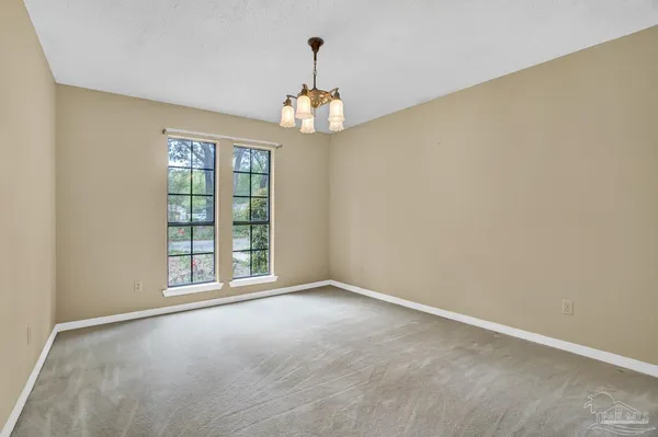 a park view with potted plants and large trees