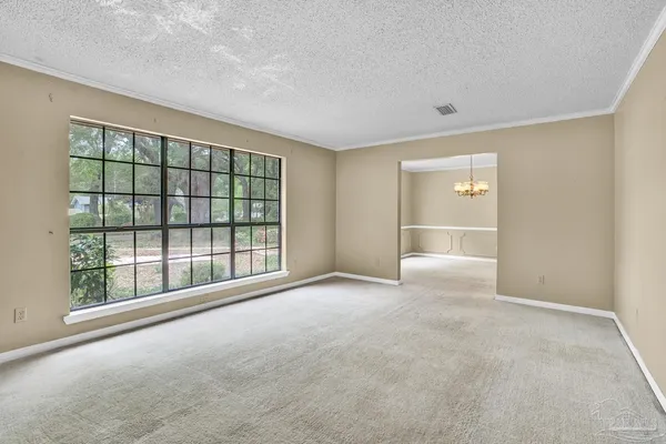 a view of an empty room with a window