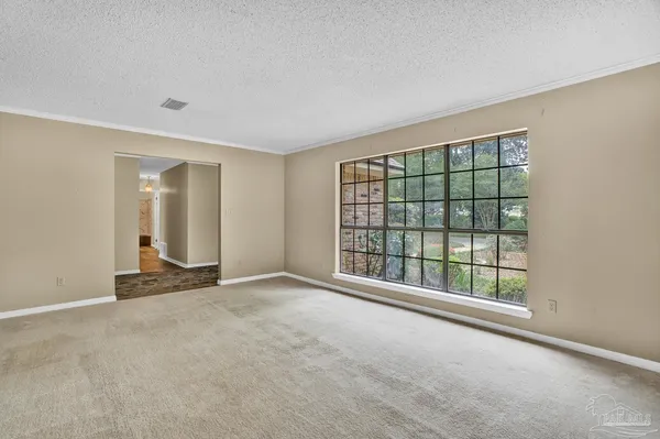 a view of a room with a chandelier and living room
