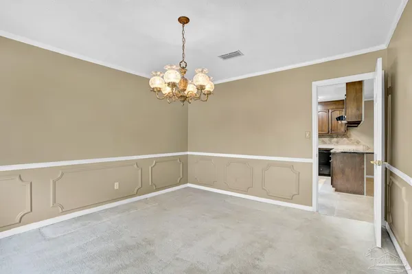 a kitchen with cabinets stainless steel appliances and a counter space