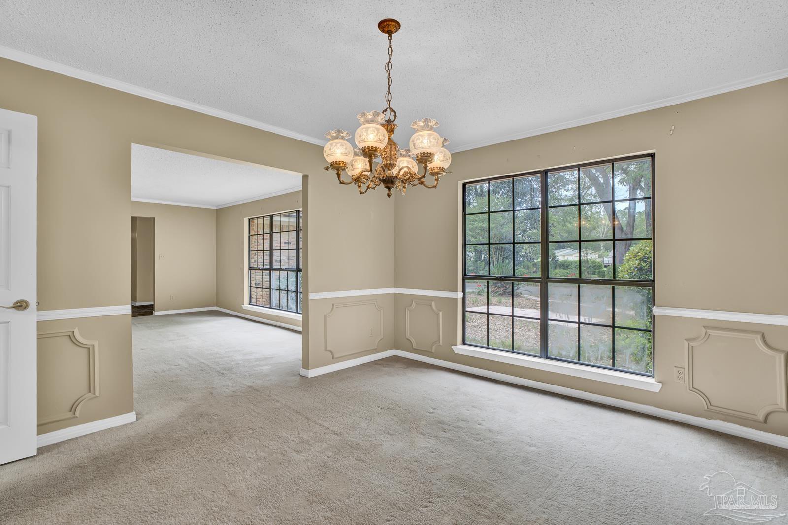 5036 Hamilton Lane Pace, FL 32571 - Photo 6 of 37 a view of a room with a chandelier and living room