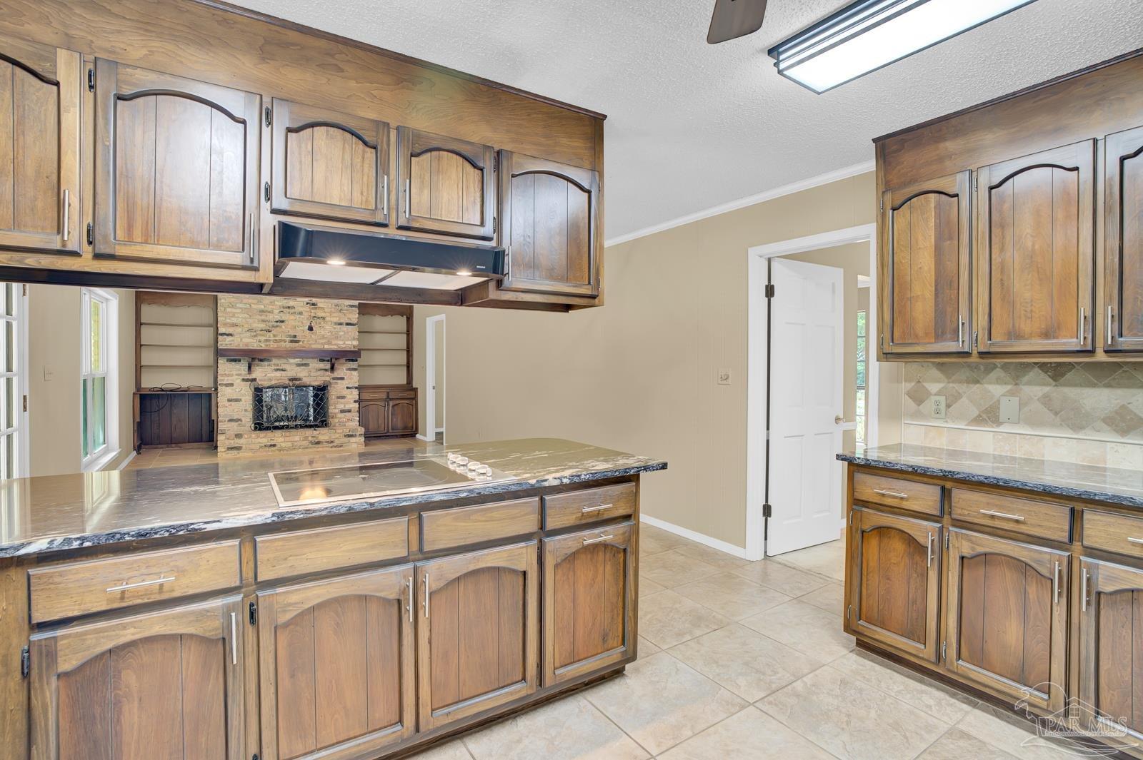 5036 Hamilton Lane Pace, FL 32571 - Photo 8 of 37 a kitchen with cabinets stainless steel appliances and a counter space