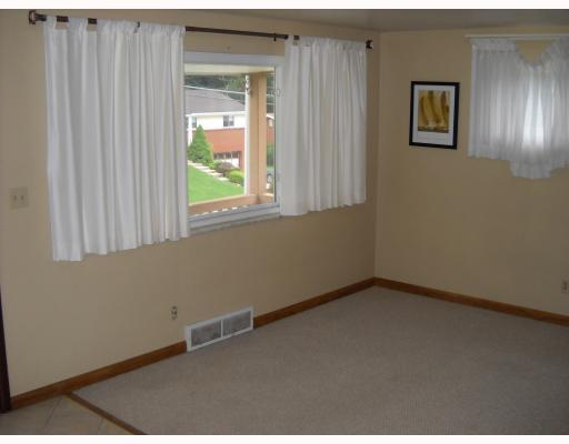 612 Idlewood Road Penn Hills, PA 15235 - Photo 3 of 5 Living Room. Neutral Paint w/ lots of natural sunlight. Wall to Wall carpeting & ceramic tile.