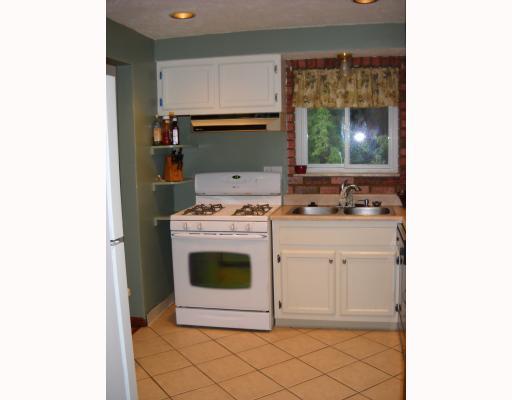 612 Idlewood Road Penn Hills, PA 15235 - Photo 4 of 5 Kitchen. Cozy kitchen w/ new ceramic tile flooring & view to the back yard.