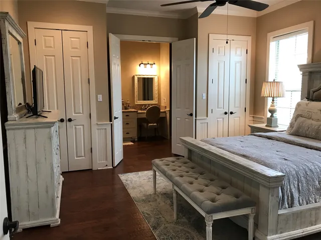 a bedroom with a bed and a view of bathroom