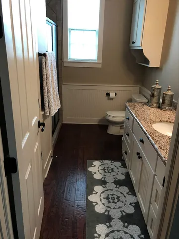 a kitchen with a sink a stove a refrigerator and a window