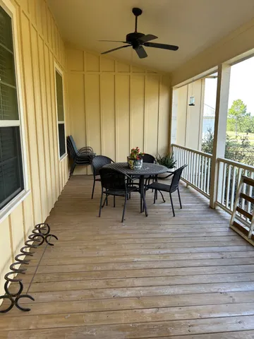 a view of a dining room with furniture and window