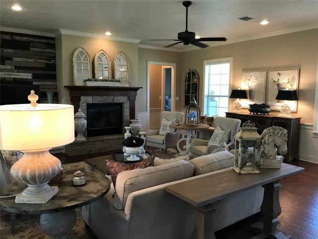 a living room with furniture and a fireplace
