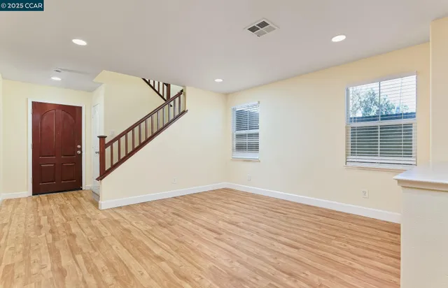 a view of an entryway with wooden floor