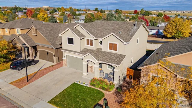 a aerial view of a house with a yard