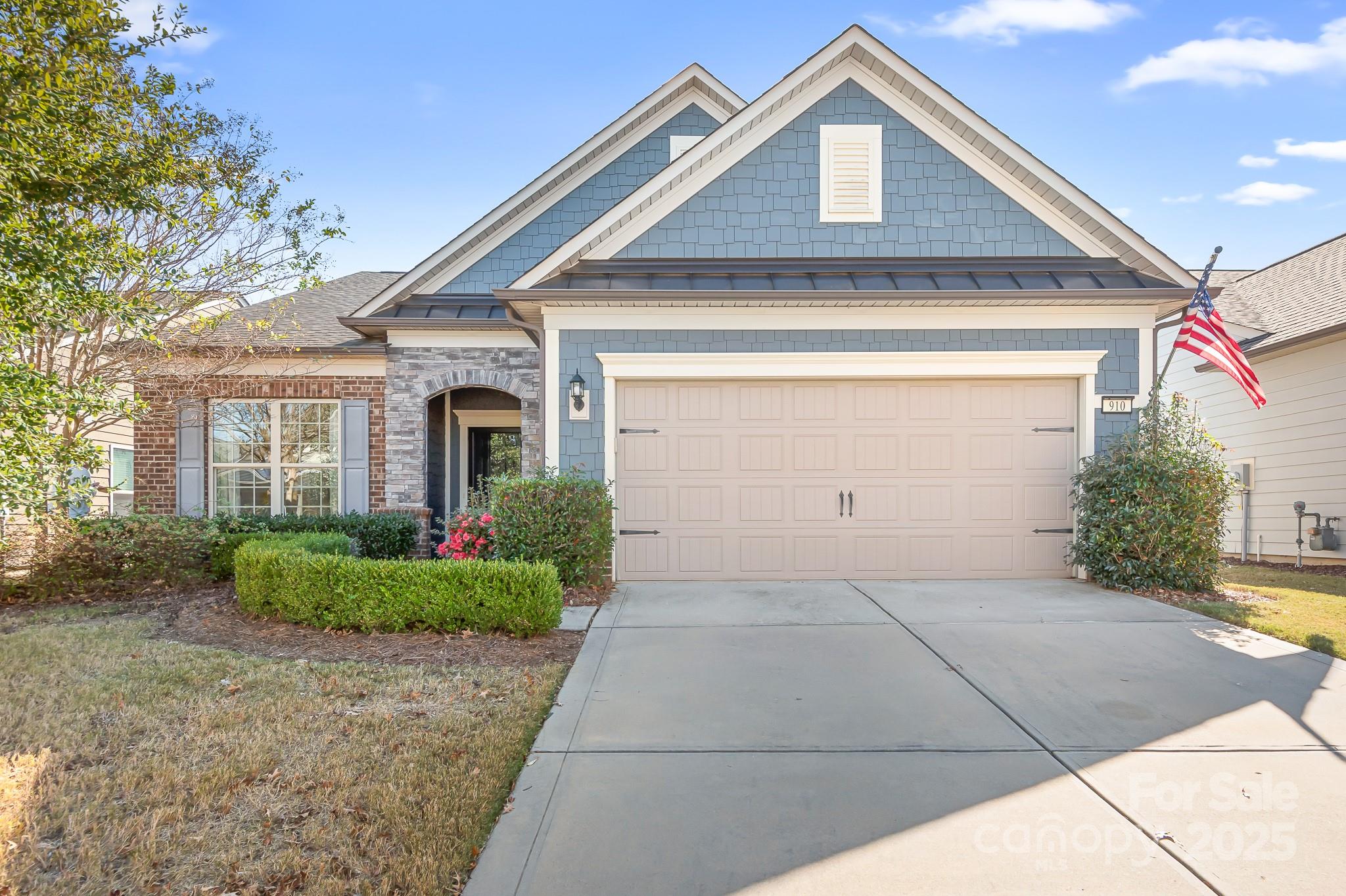 a front view of a house with garden